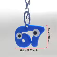 Søt 67-nøkkelring med øyne