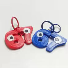 Søt 67-nøkkelring med øyne